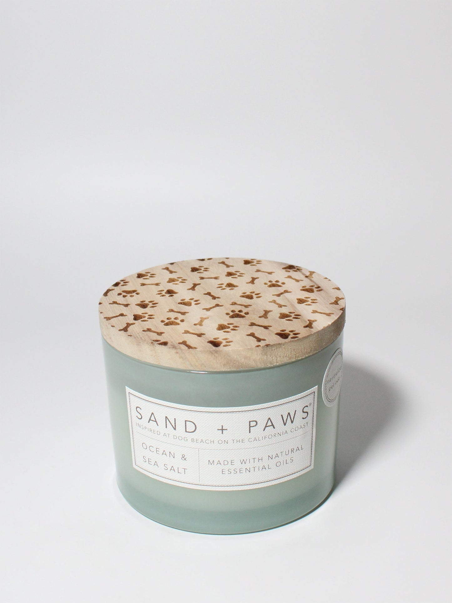 Sand + Paws Ocean & Sea Salt 12 oz scented candle Seaglass vessel with Carved Paws and Bones lid