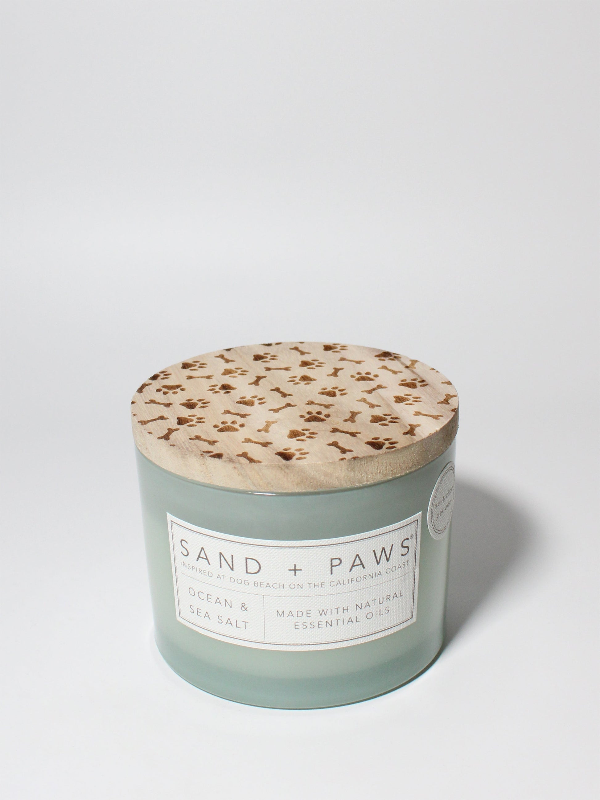 Sand + Paws Ocean & Sea Salt 12 oz scented candle Seaglass vessel with Carved Paws and Bones lid