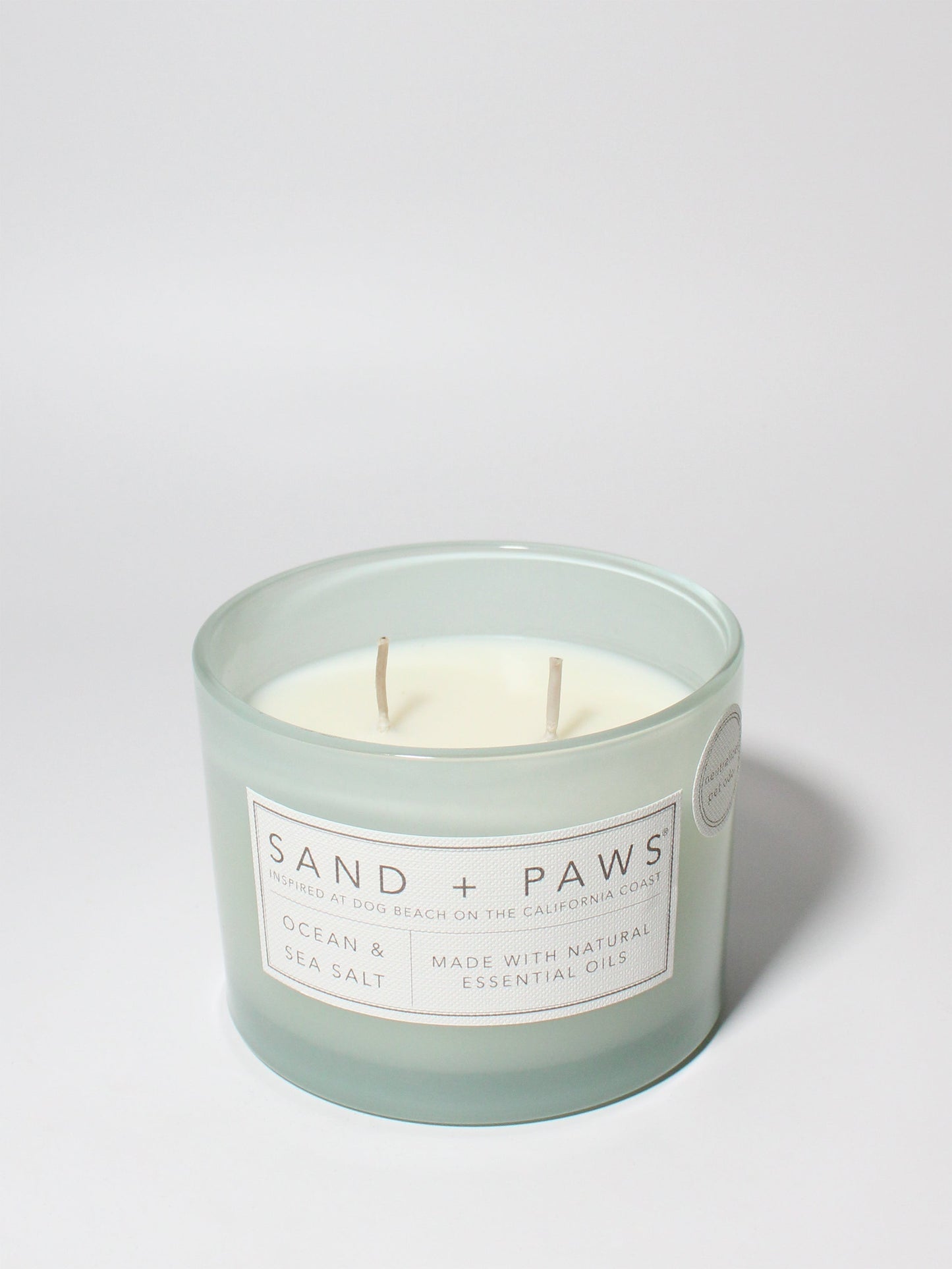 Sand + Paws Ocean & Sea Salt 12 oz scented candle Seaglass vessel with Carved Paws and Bones lid