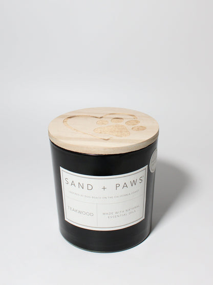 Sand + Paws Teakwood 21 oz scented candle Black vessel with Paw in Heart lid
